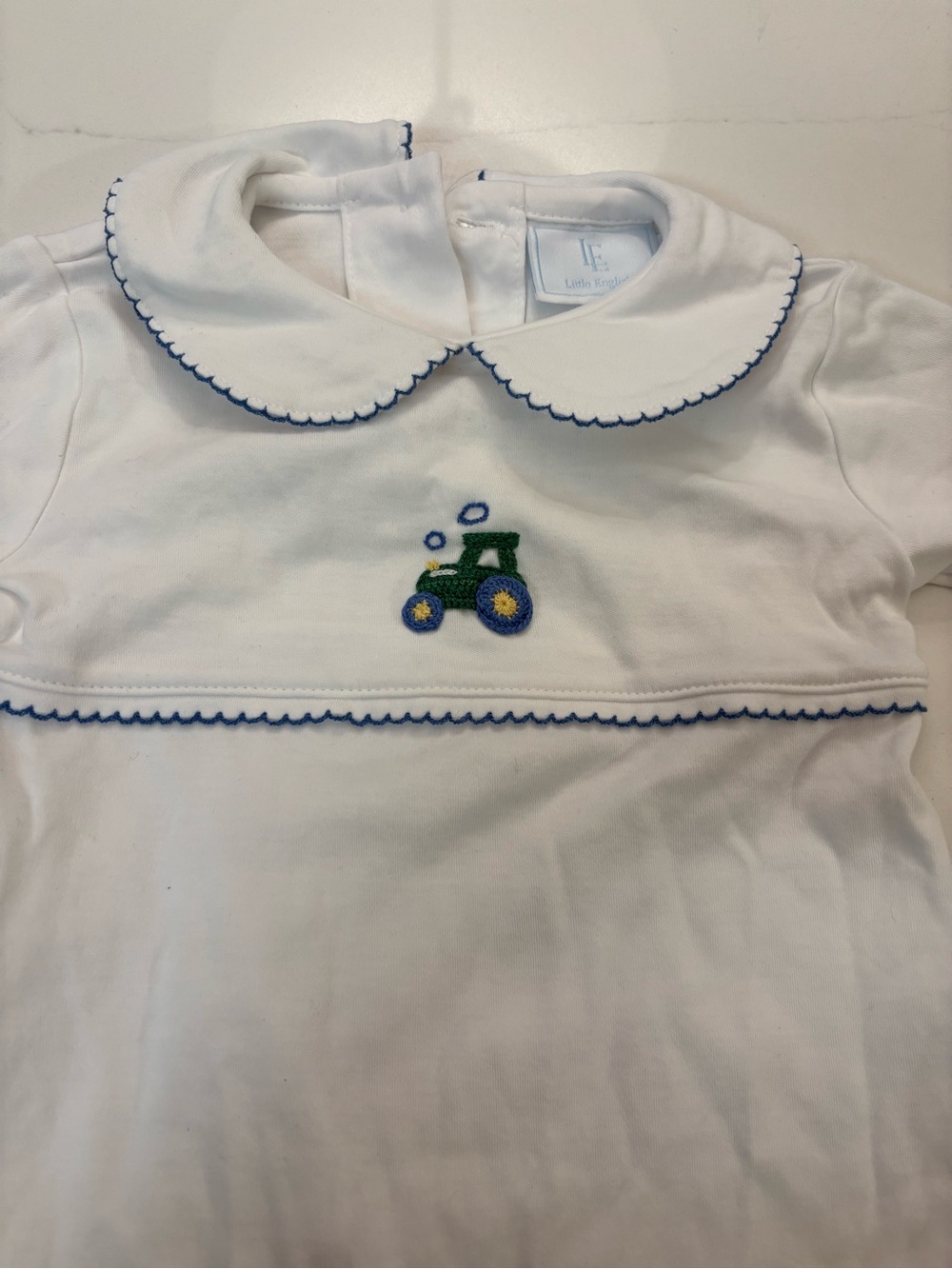 Little English White Romper with Blue Trim and Green Tractor Embroidery